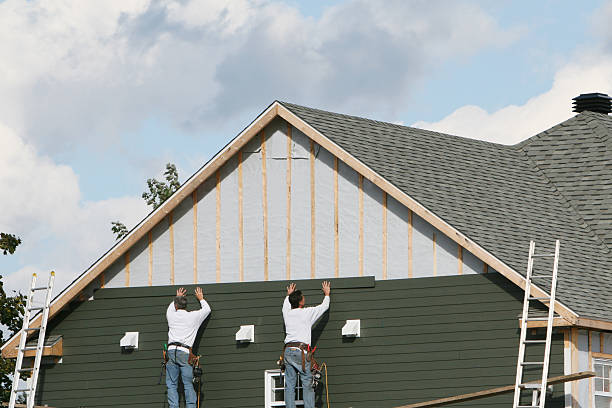 Professional Storm Damage Siding Repair technician working in Sparta, NC